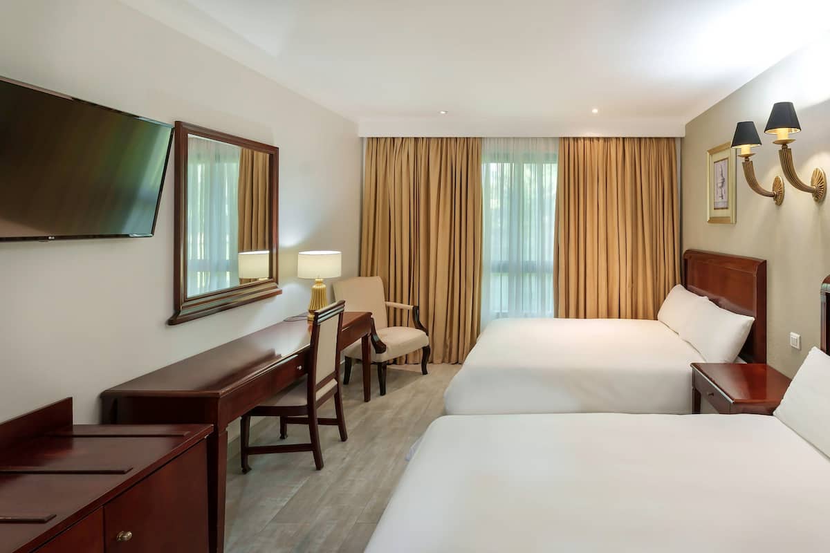 room, 2 queen beds, garden view | 1 bedroom, down duvets, in-room safe, desk