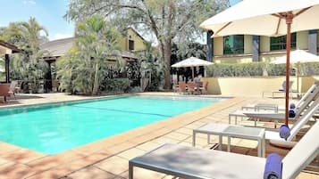 Outdoor pool, pool umbrellas, sun loungers