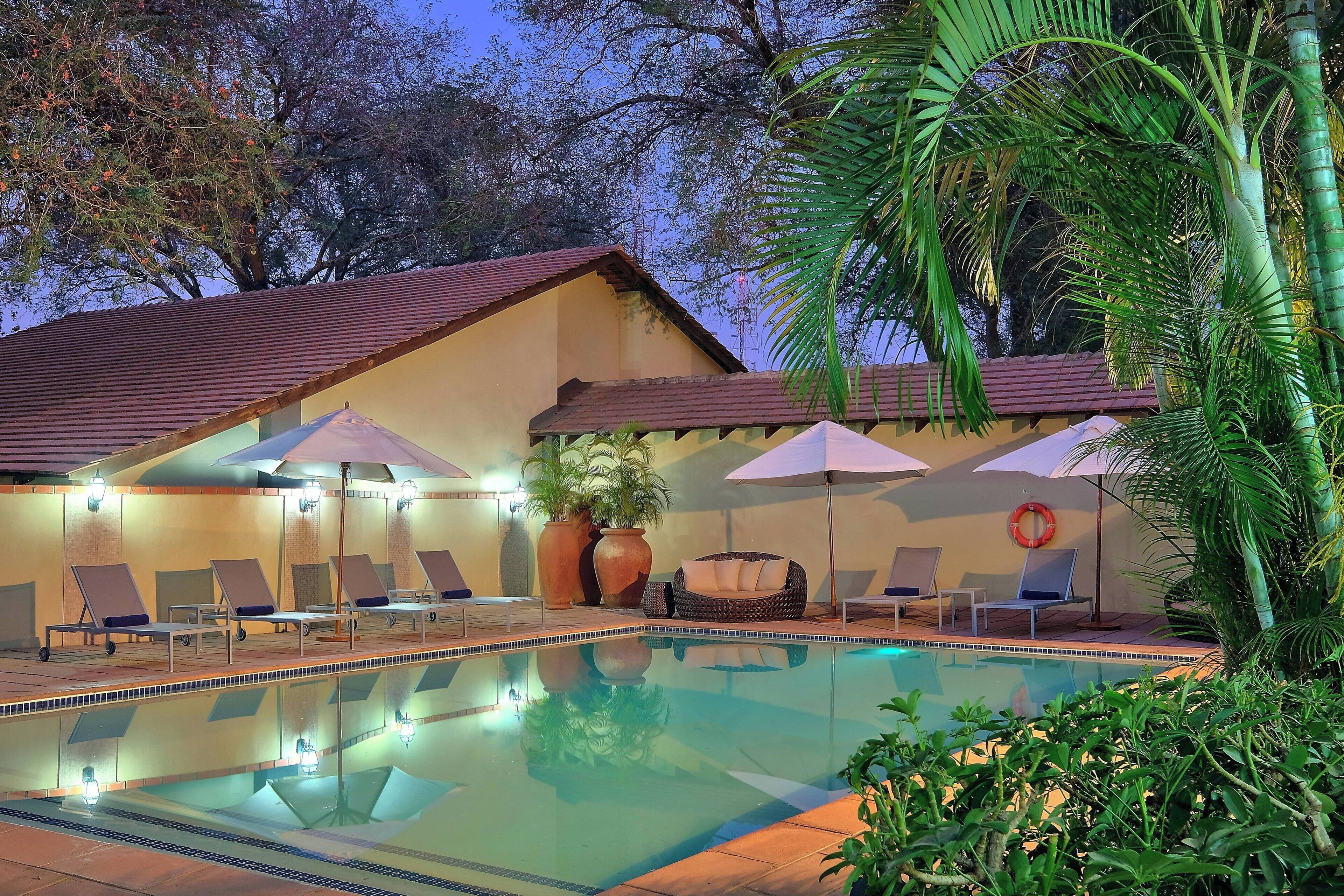 outdoor pool, pool umbrellas, pool loungers