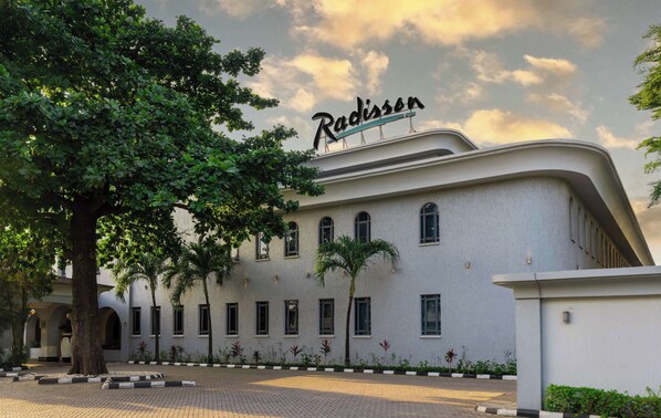 A modern building with the name "Radisson" on the facade.