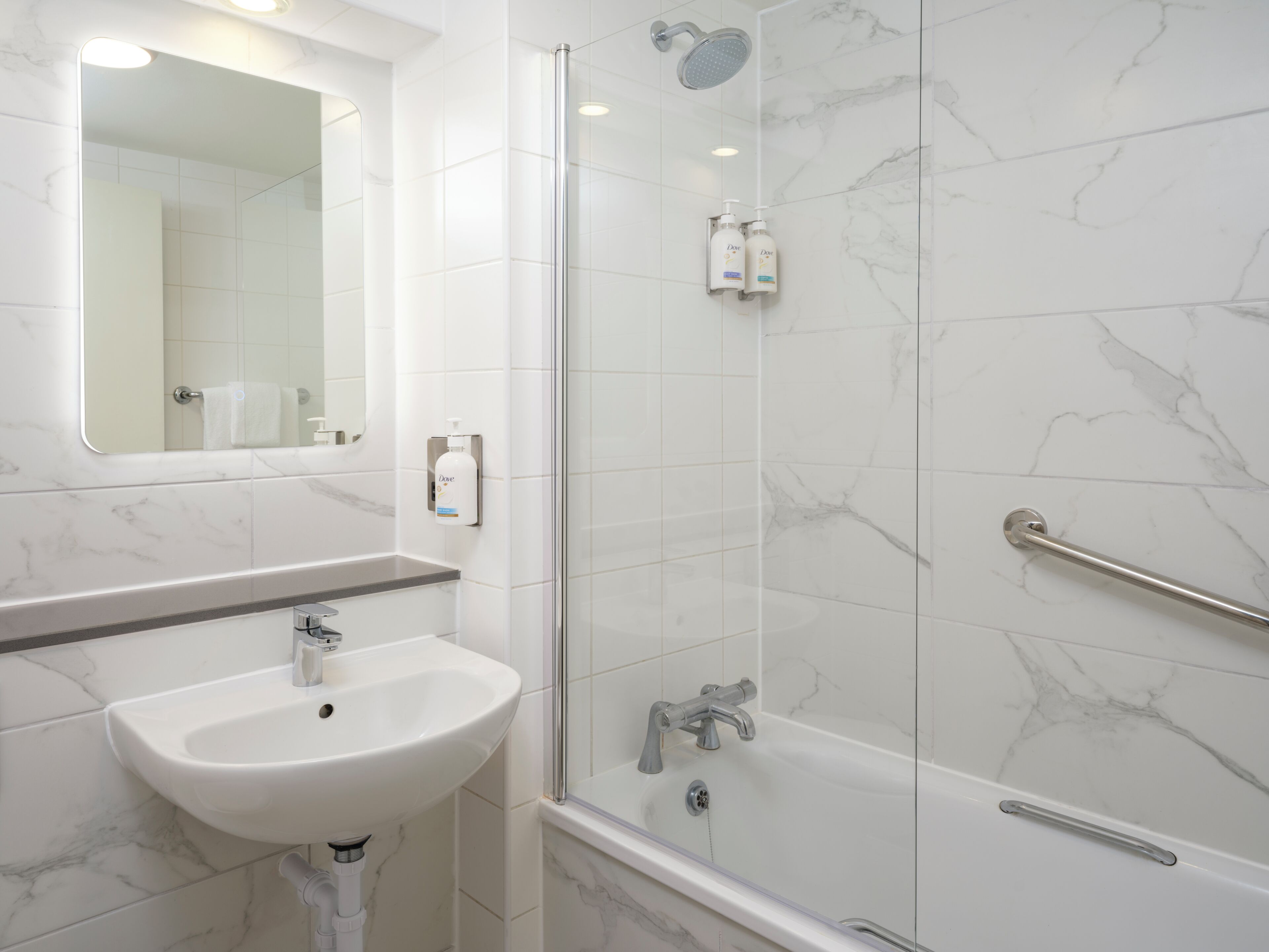 Designer toiletries, hair dryer, towels