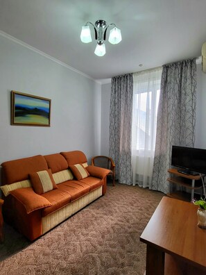 Suite Junior | Coin séjour | Télévision