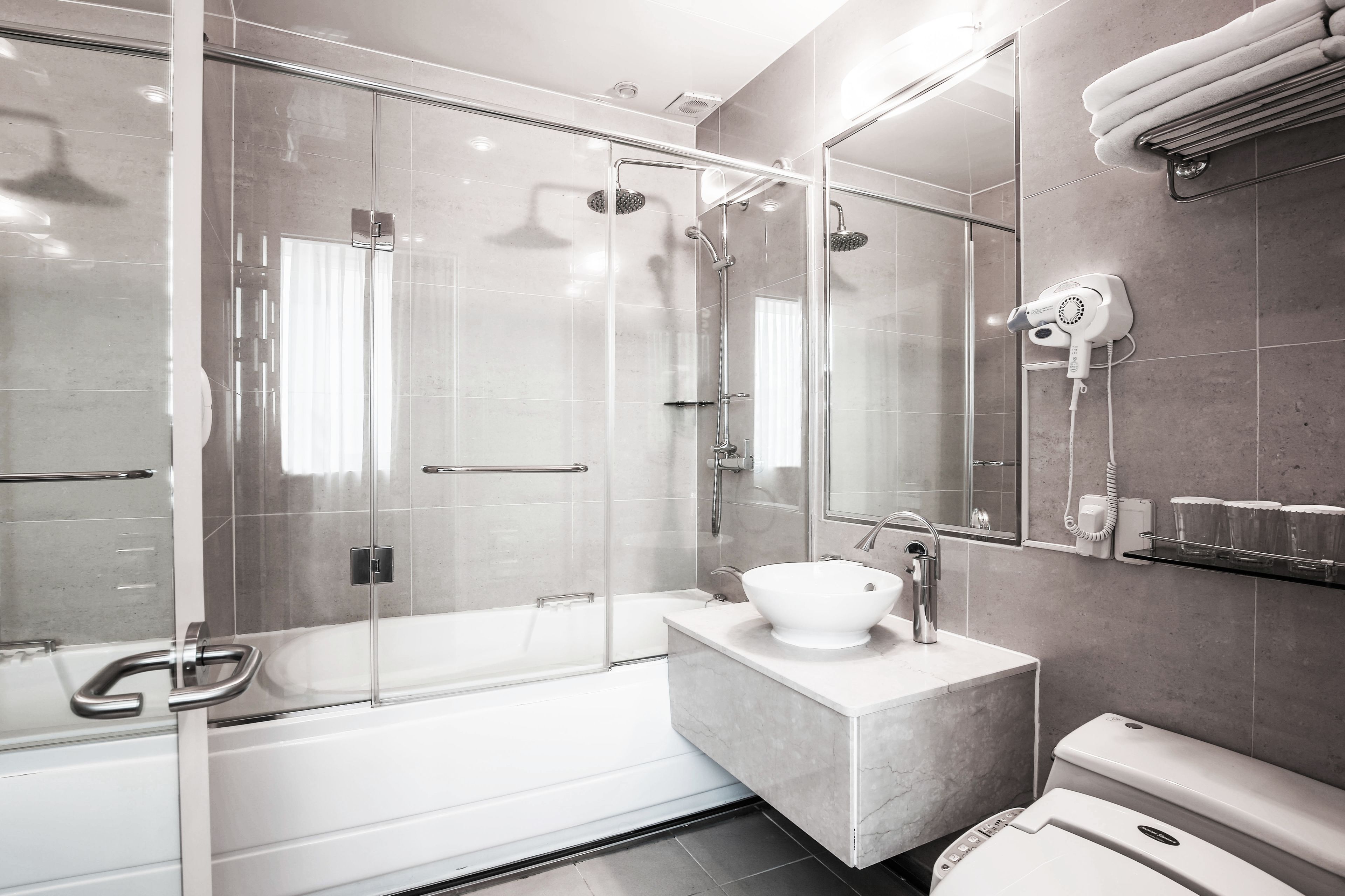 suite (namsan tower view) | bathroom | free toiletries, hair dryer, slippers, bidet