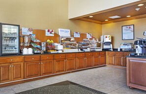 A breakfast buffet area with various food options and a coffee station. - Holiday Inn Express & Suites Somerset Central by IHG (Somerset)
