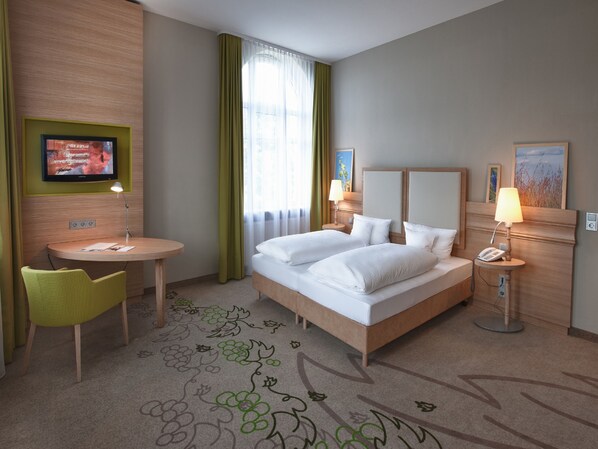 Ropa de cama hipoalergénica, camas con pillow-top y minibar 