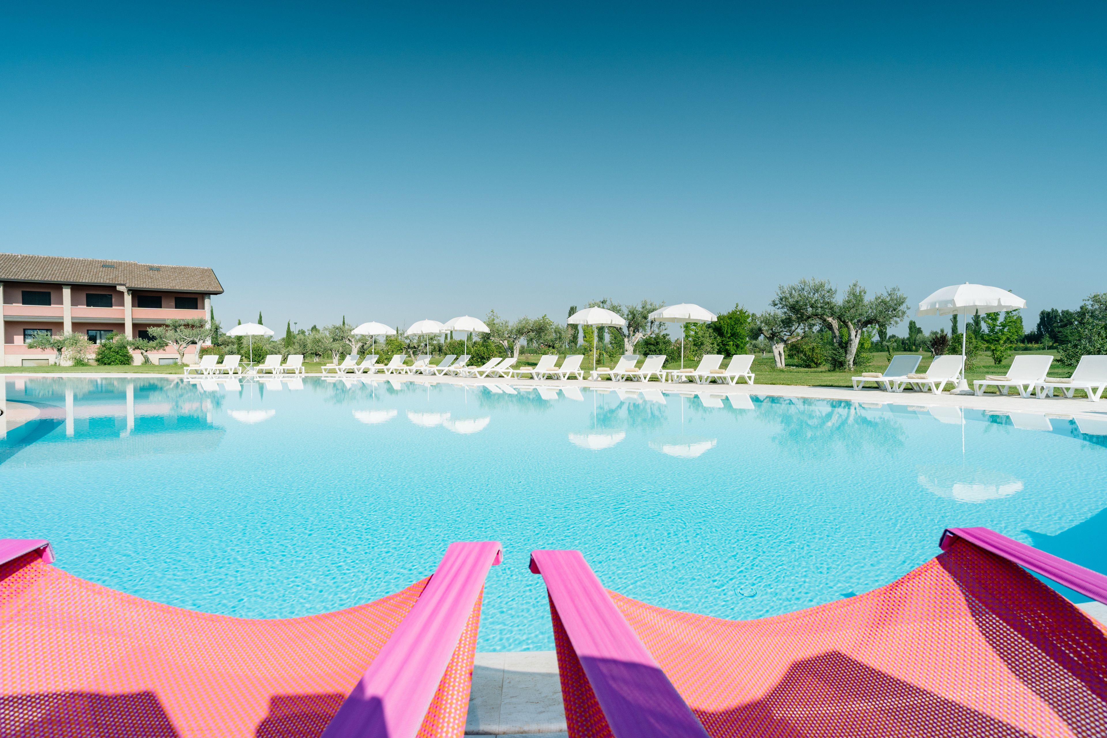 seasonal outdoor pool, pool umbrellas, pool loungers