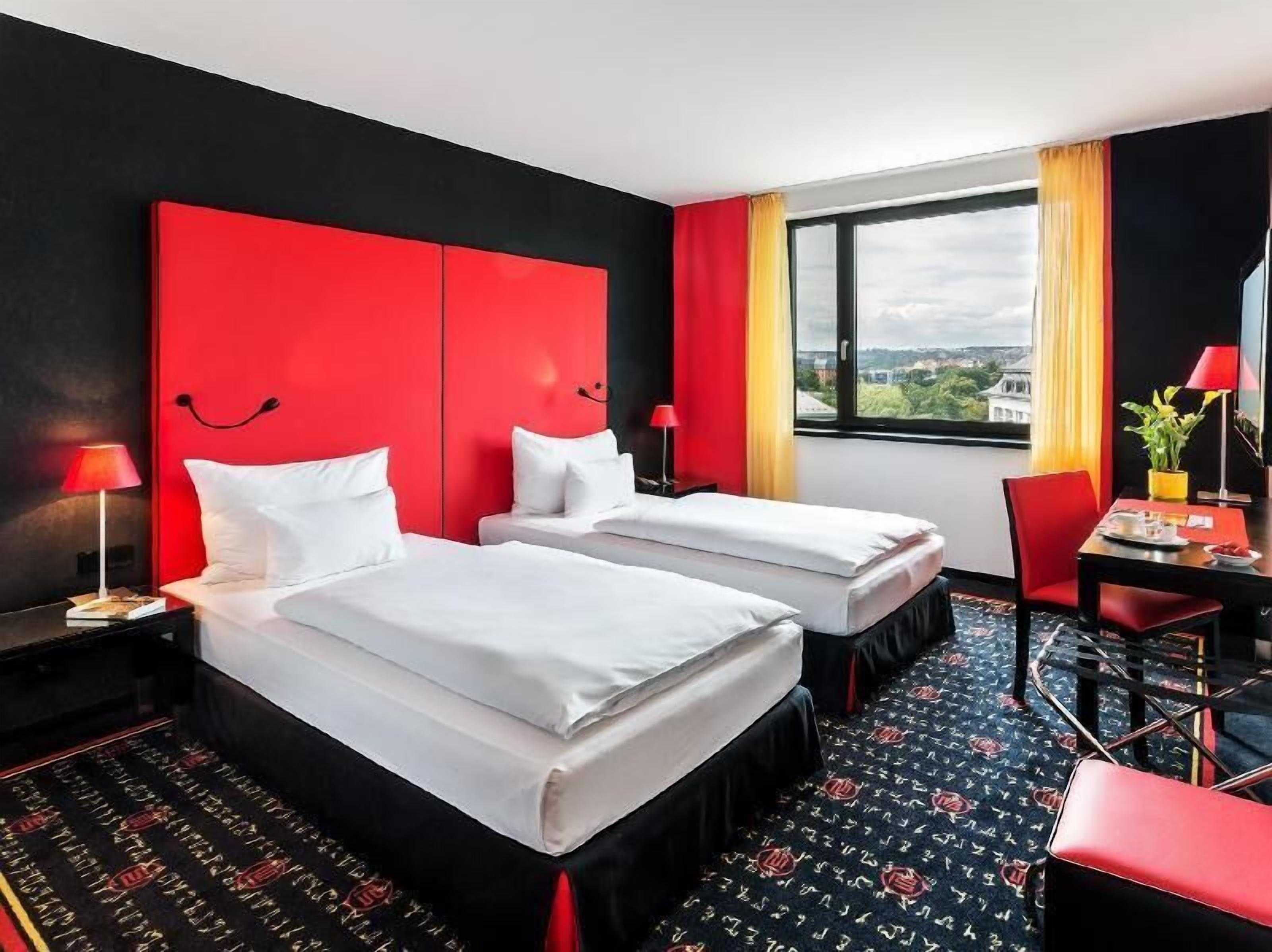 Hypo-allergenic bedding, down comforters, minibar, in-room safe