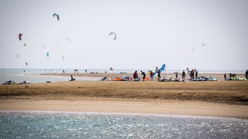 Guests can enjoy kite flying on this public beach with stunning ocean views.