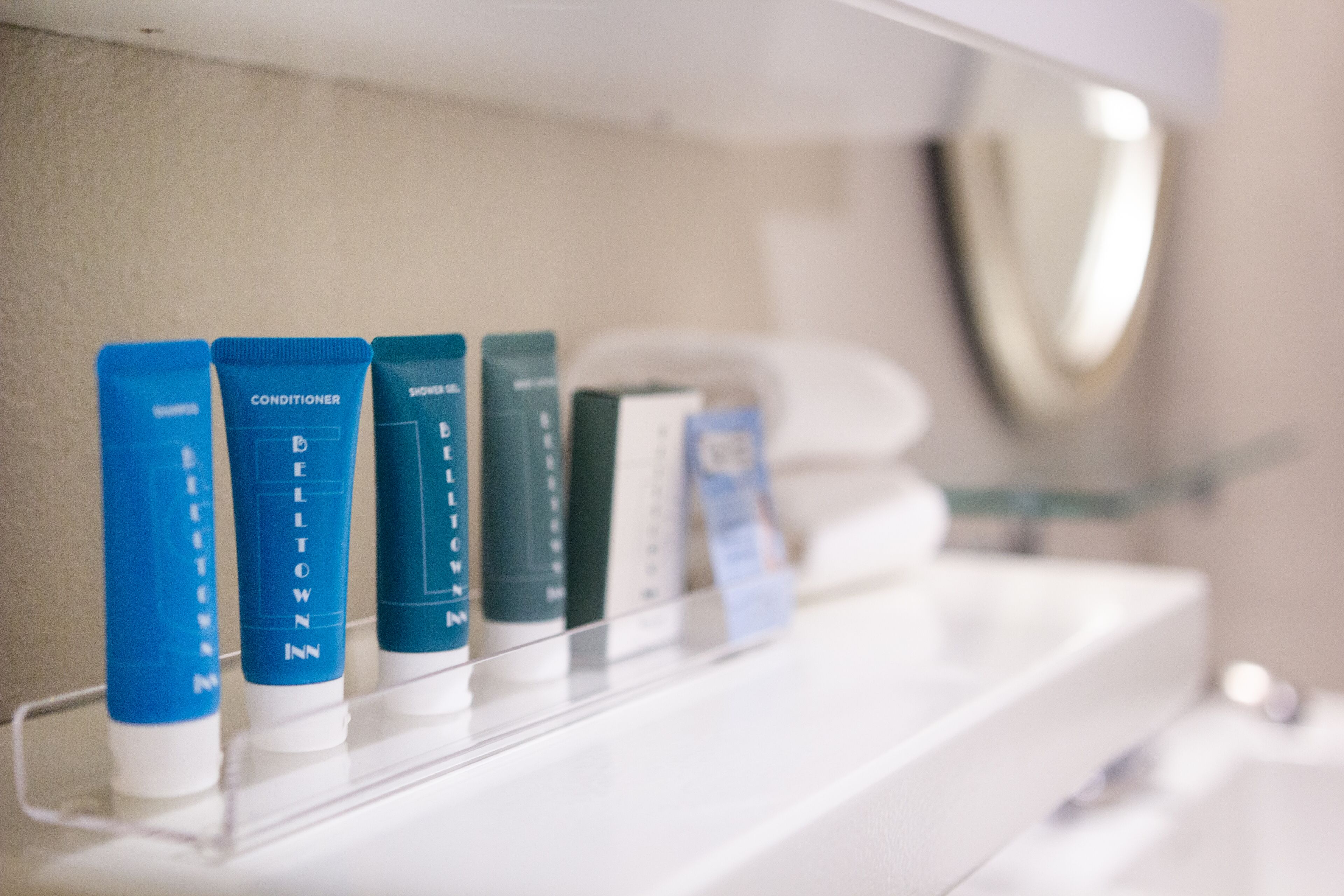 eco-friendly toiletries, hair dryer, towels