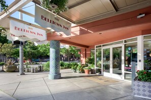 The exterior of Bell Town Inn with signage, potted plants, and a clear entrance.