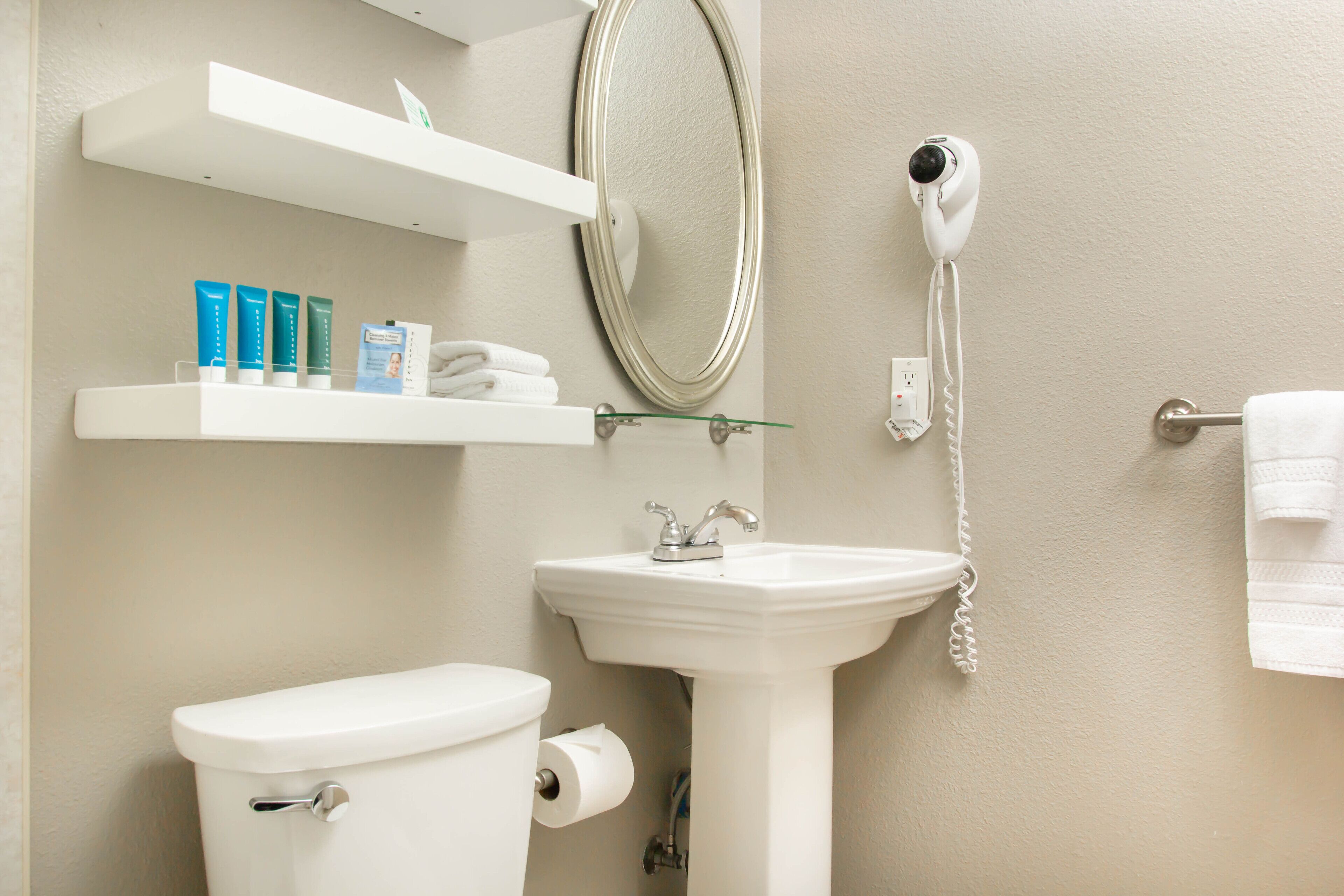 queen guestroom | bathroom | eco-friendly toiletries, hair dryer, towels