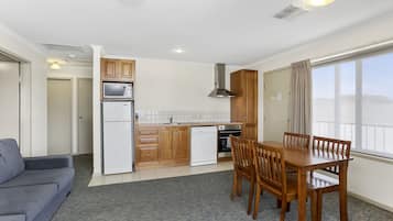 Two Bedroom Apartment | Private kitchen | Fridge, microwave, coffee/tea maker, electric kettle
