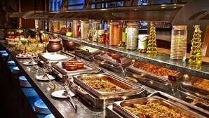 A buffet with various food items and condiments. - Fort Khejarla, Jodhpur (Bilara)