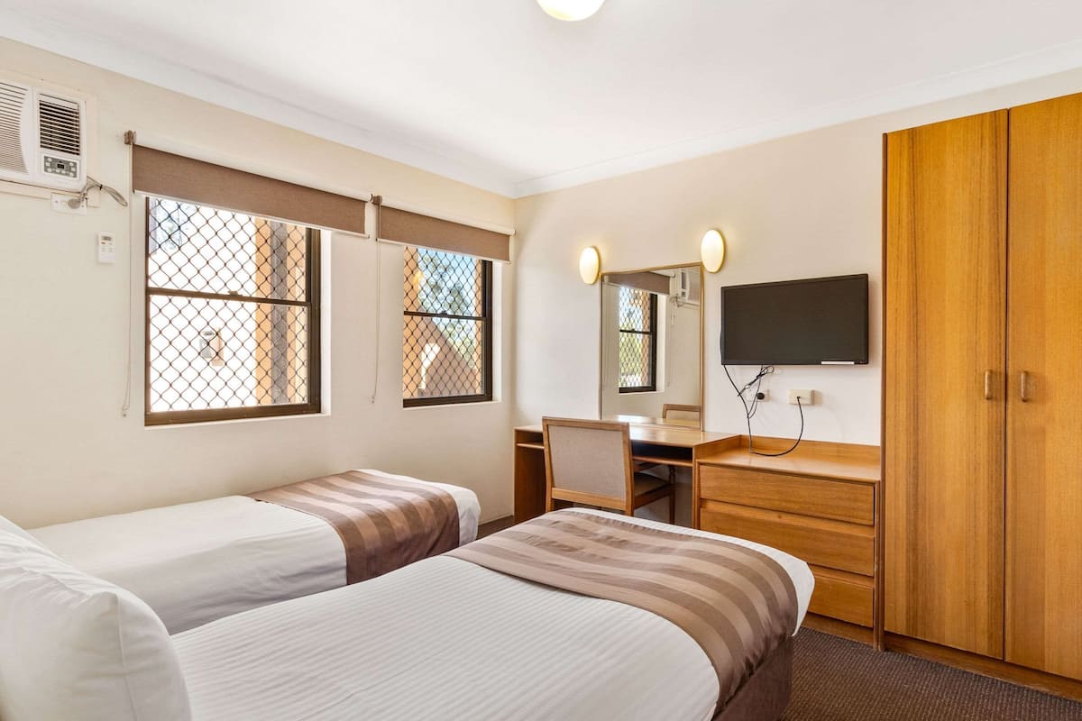 two bedroom family room  | iron/ironing board, free wifi, bed sheets, alarm clocks