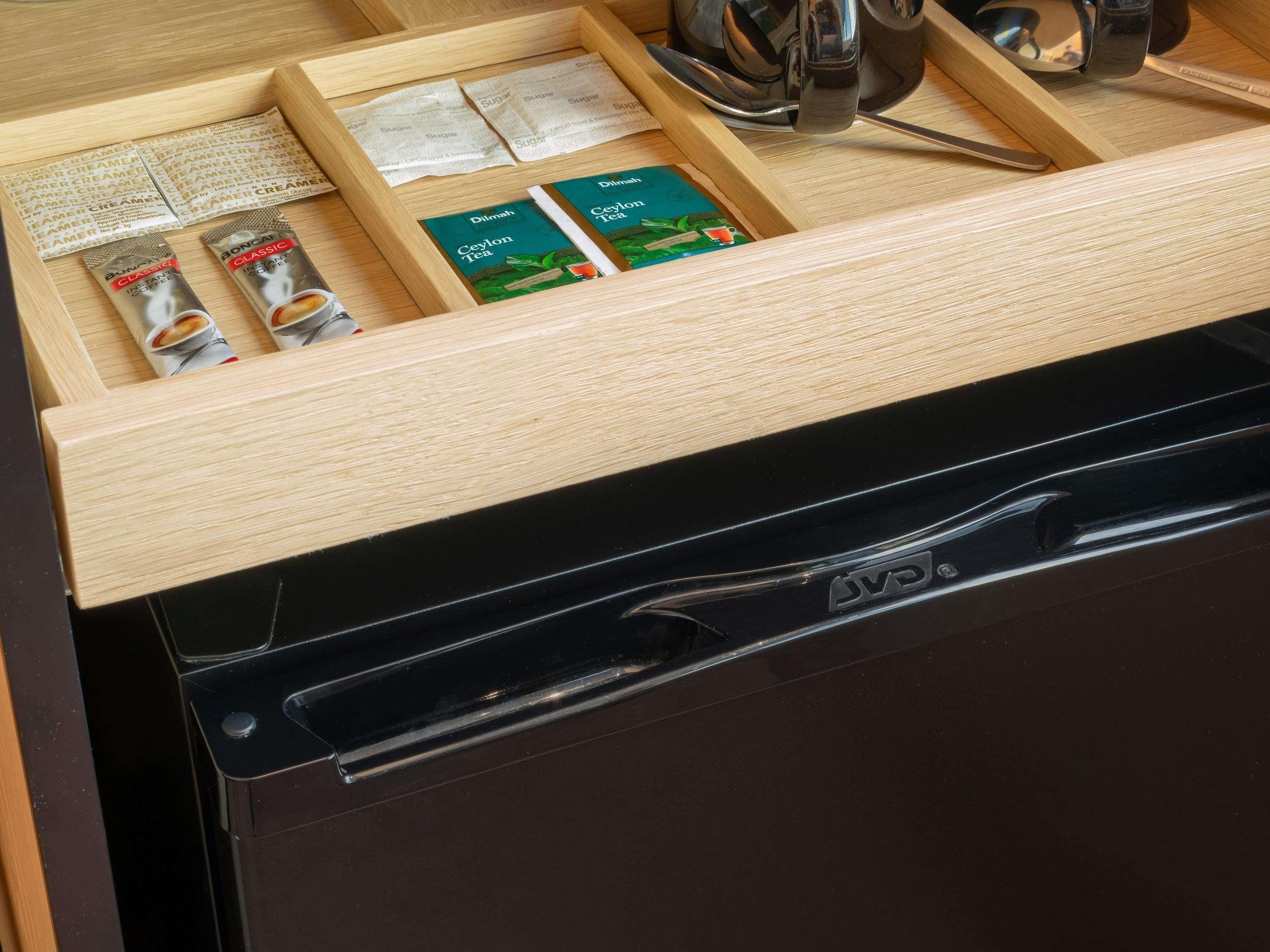 A drawer with tea bags and a tea box.
