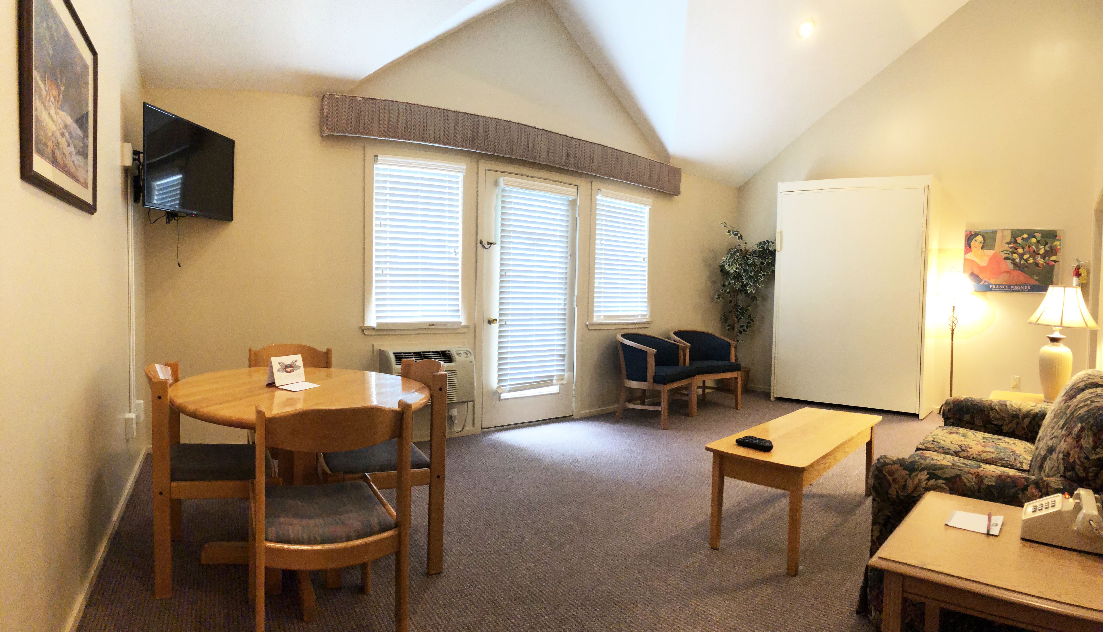 1 bedroom unit, 1 queen wall bed, queen sleep sofa  | living room | flat-screen tv