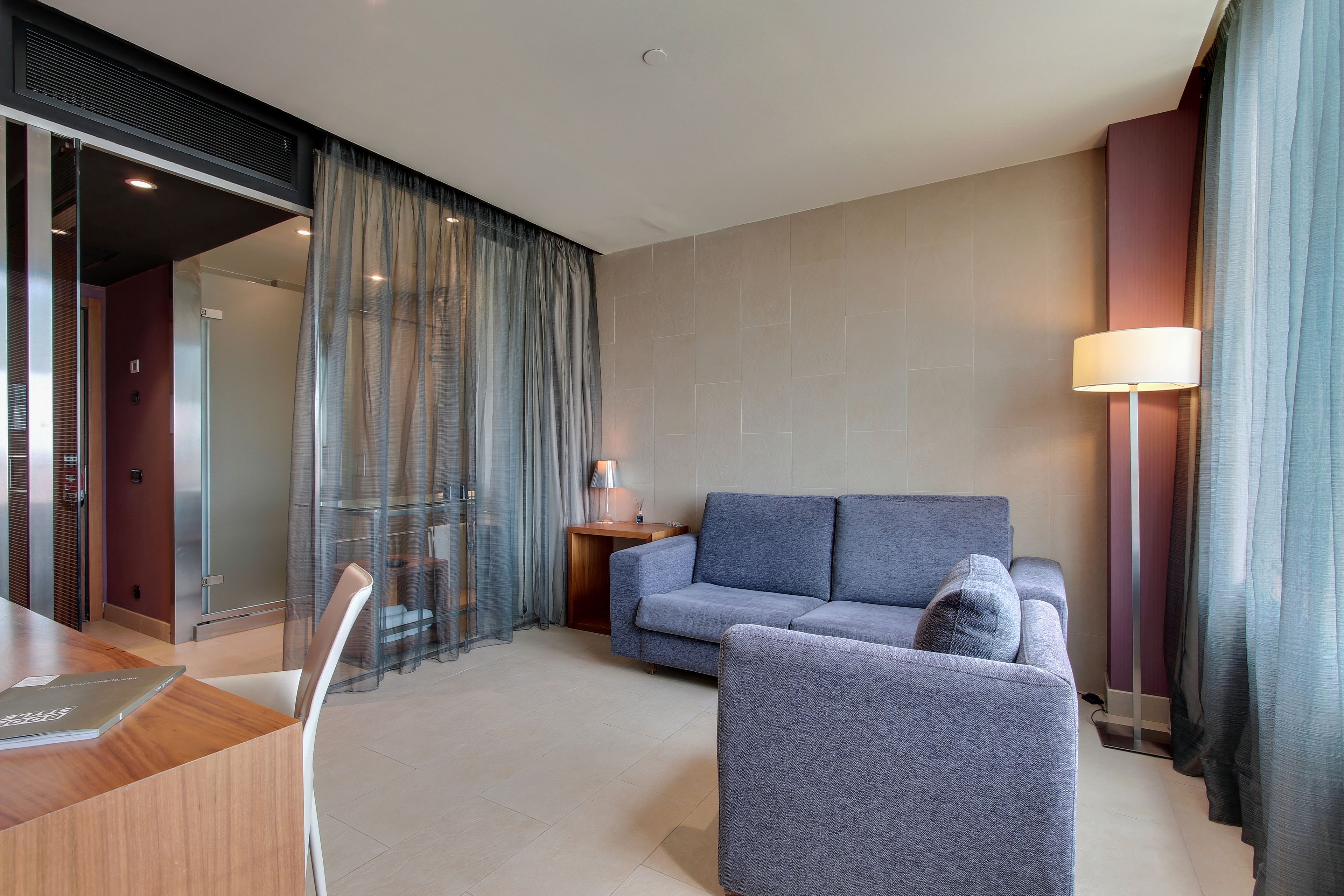 junior suite | living area | flat-screen tv