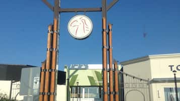 A sign for Crossiron Mills with a large circular logo and a welcoming entrance.