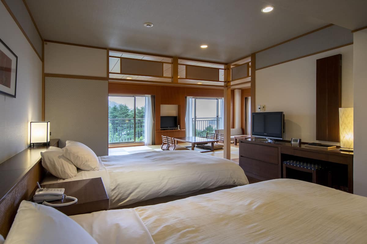 junior suite room with garden view, non-smoking | 1 bedroom, in-room safe, blackout curtains, free wifi