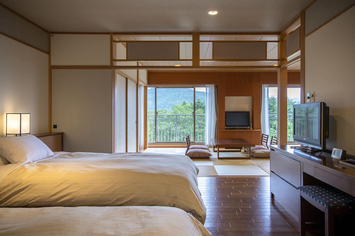 Junior suite room with Garden View, Non-smoking | In-room safe, blackout drapes, free WiFi, bed sheets