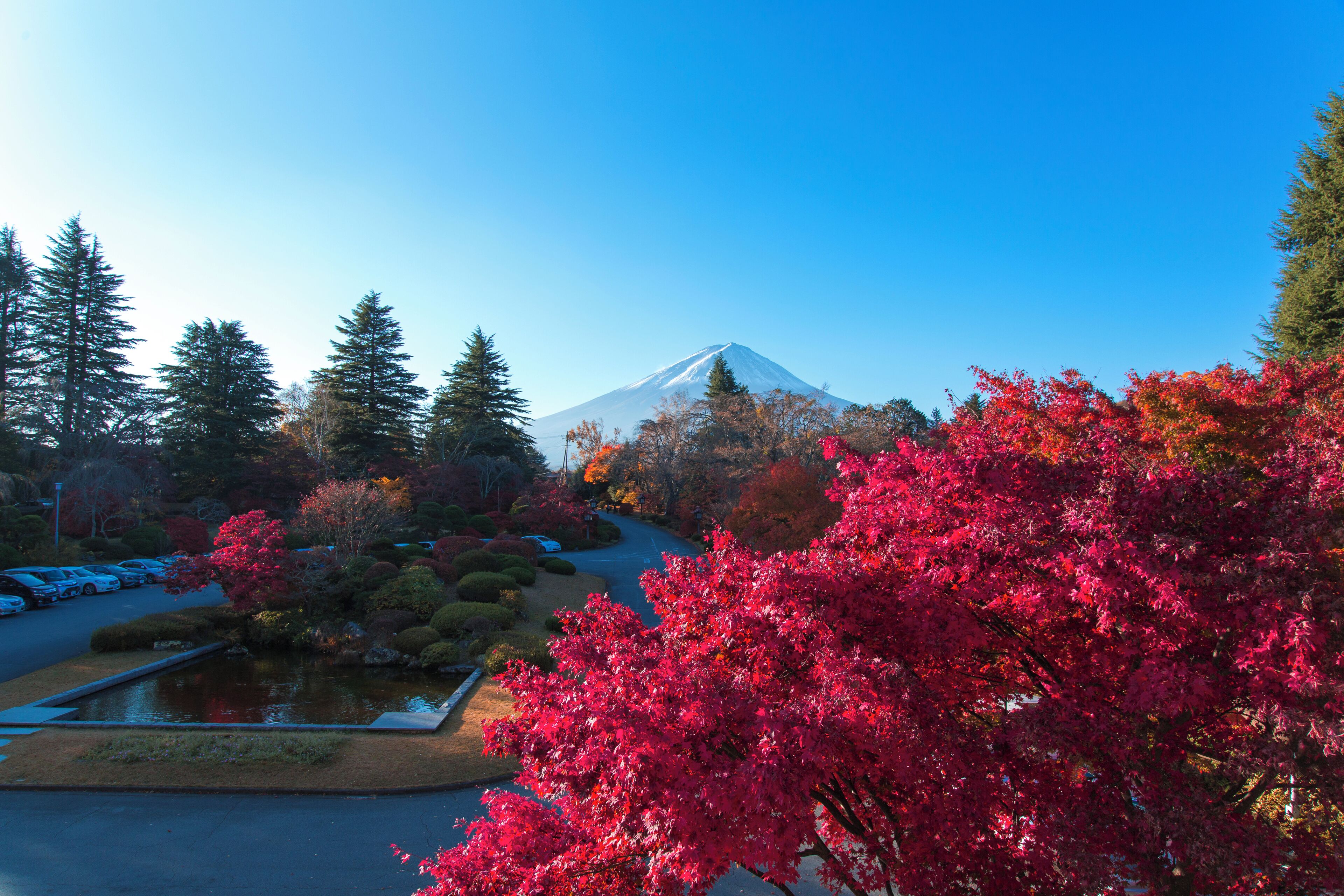 A parking lot with a view of a mountain.