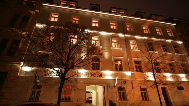 A multi-story building with a sign reading "SUSA" at the entrance. - Aparthotel Susa (Prague)