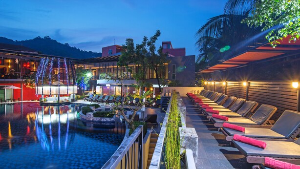 A poolside area with lounge chairs and a small pool. - Red Ginger Chic Resort (Krabi)