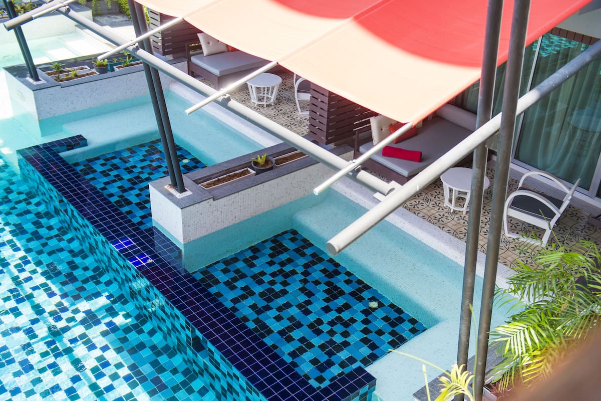 Deluxe Room, Pool Access | 1 bedroom, premium bedding, minibar, in-room safe