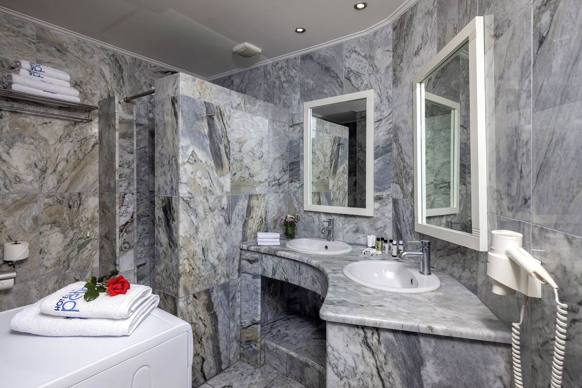 standard triple room (adjacent building) | bathroom | shower, free toiletries, hair dryer, towels