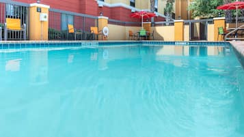 Outdoor pool, open 6 AM to 10 PM, pool loungers
