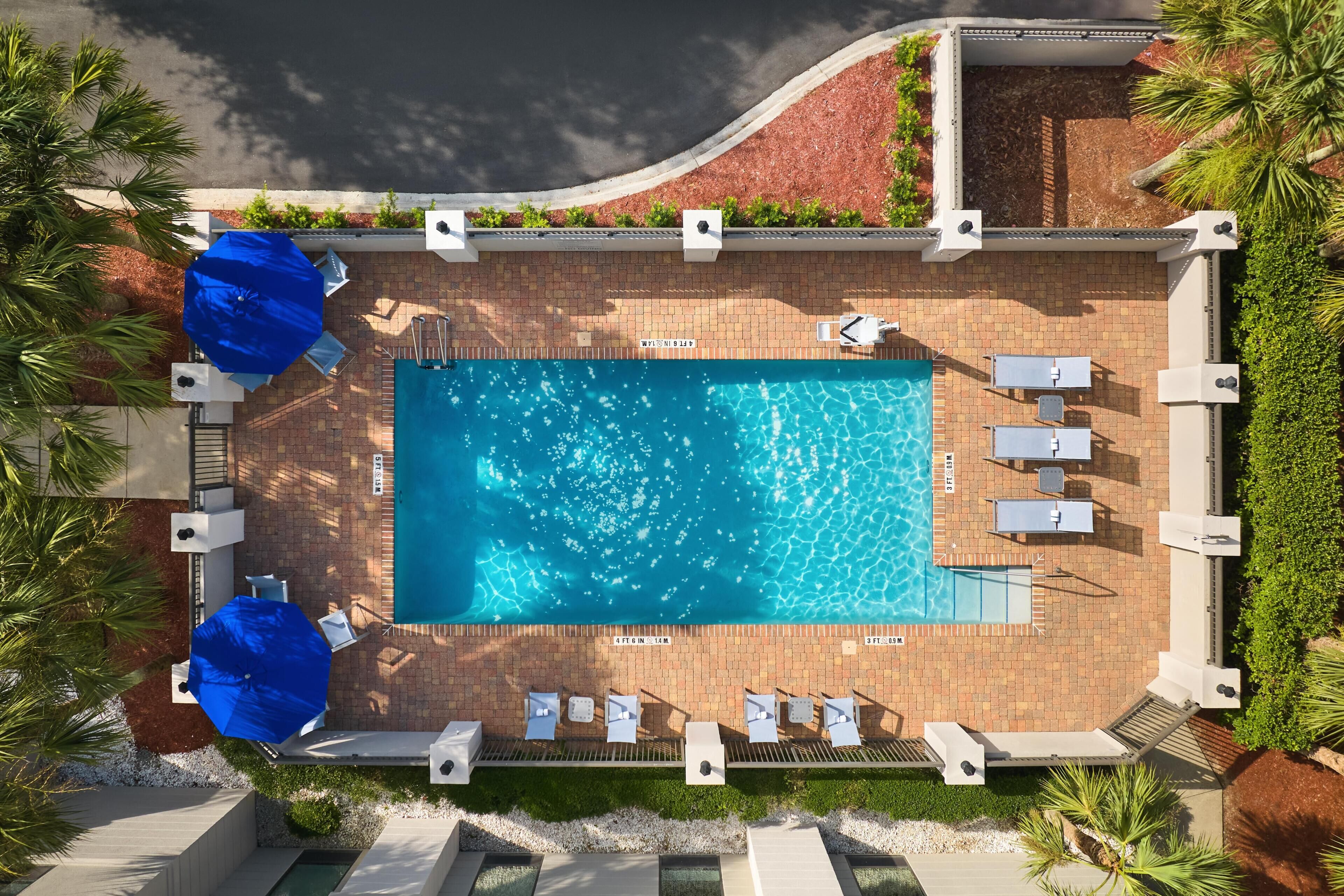 Outdoor pool, open 6 AM to 10 PM, pool loungers