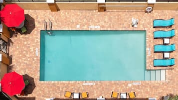 Outdoor pool, open 6 AM to 10 PM, pool loungers