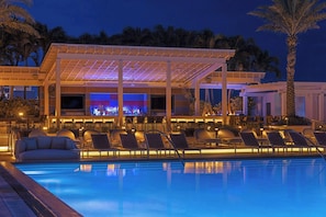 2 outdoor pools, open 8:00 AM to 7:00 PM, pool umbrellas, pool loungers