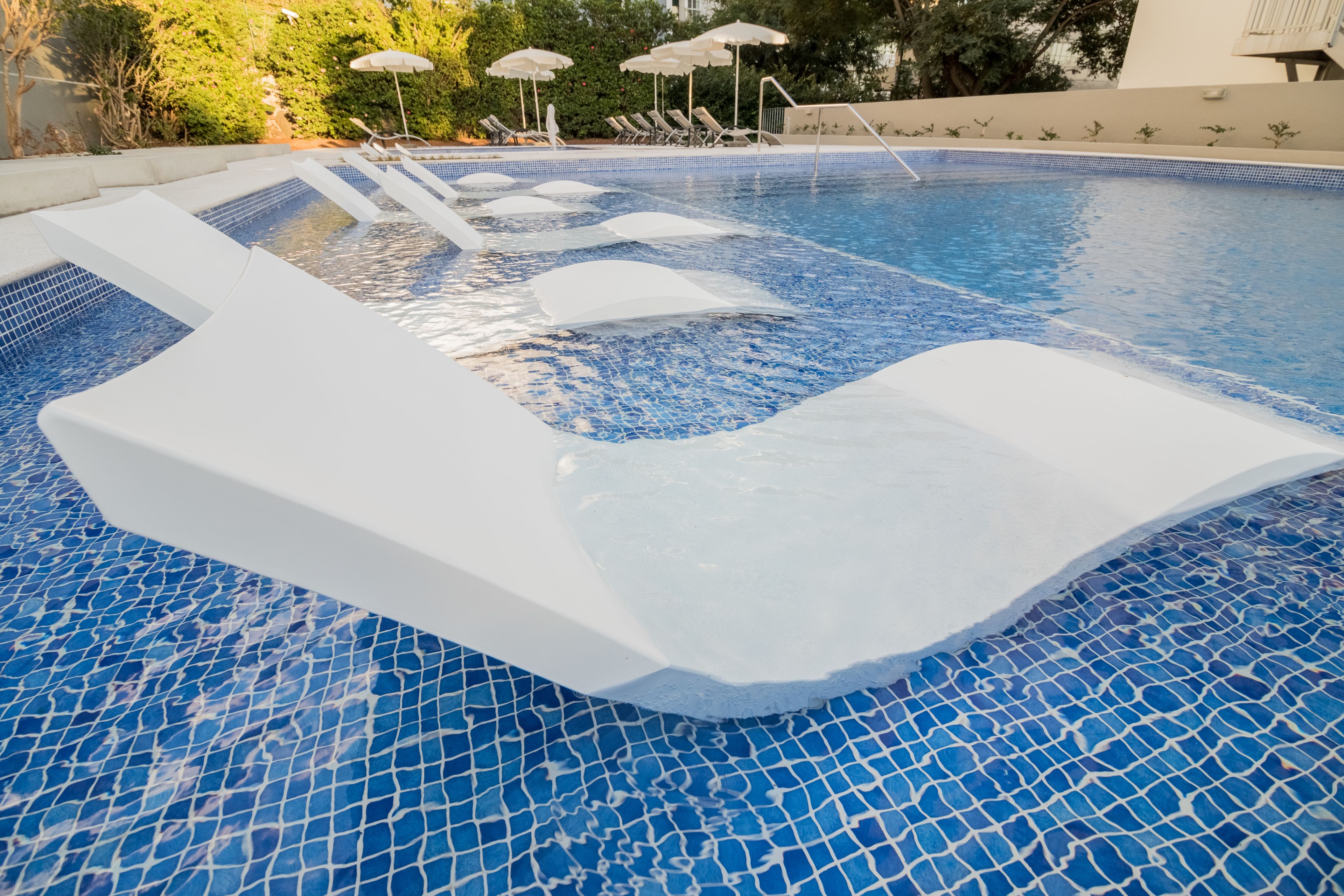 2 outdoor pools, open 9 am to 6 pm, pool umbrellas, pool loungers