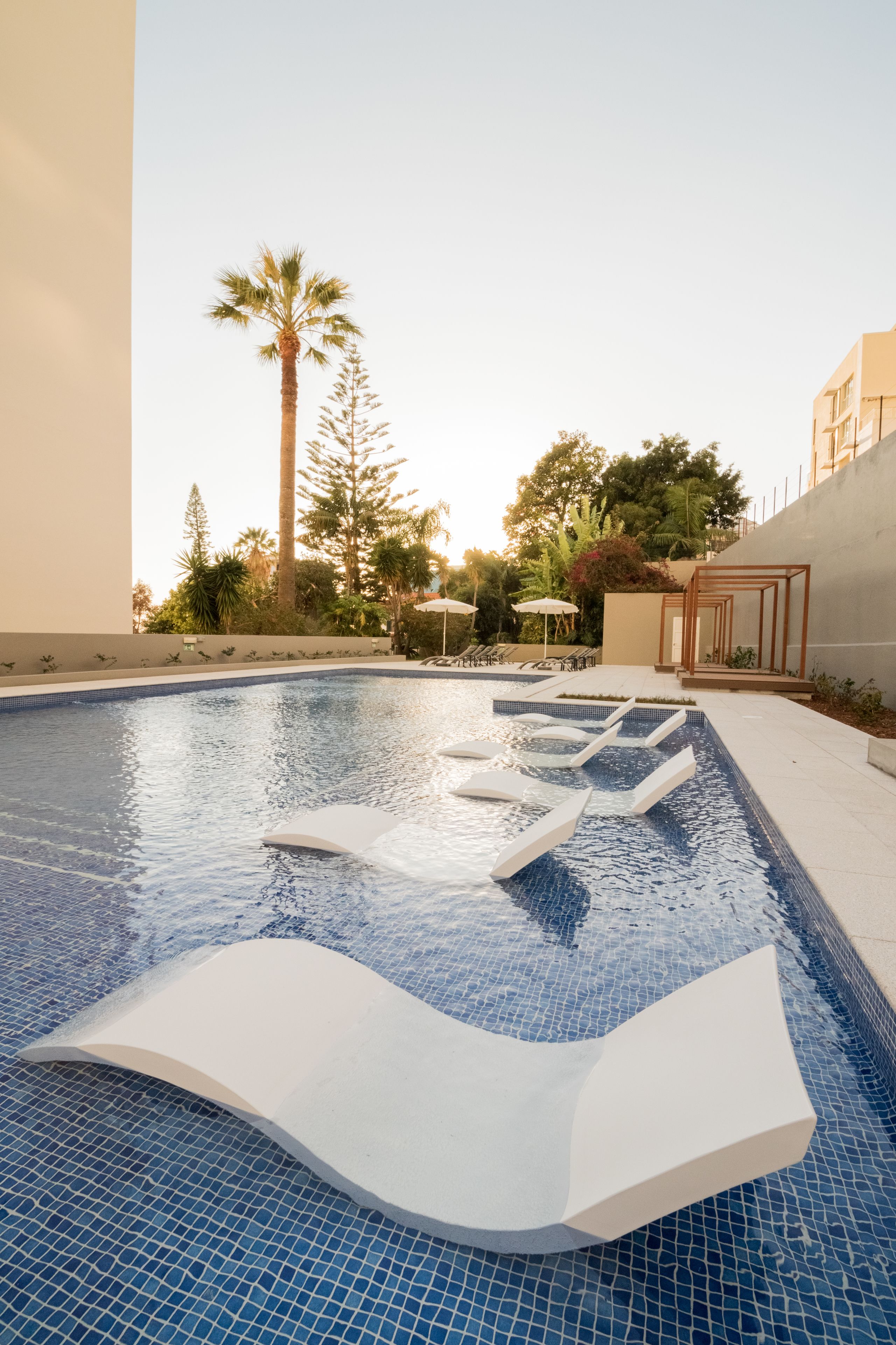 2 outdoor pools, open 9 AM to 6 PM, pool umbrellas, pool loungers