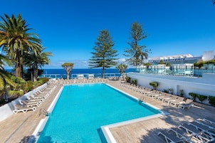 Indoor pool, outdoor pool, pool umbrellas, pool loungers