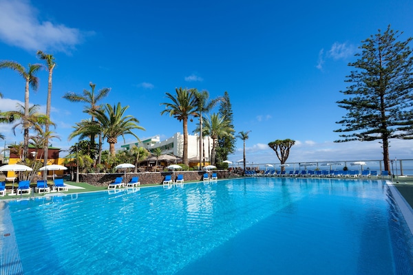 Indoor pool, outdoor pool, pool umbrellas, sun loungers
