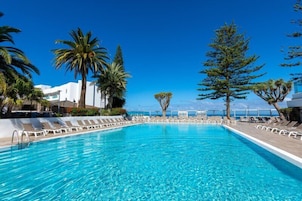 Indoor pool, outdoor pool, pool umbrellas, pool loungers