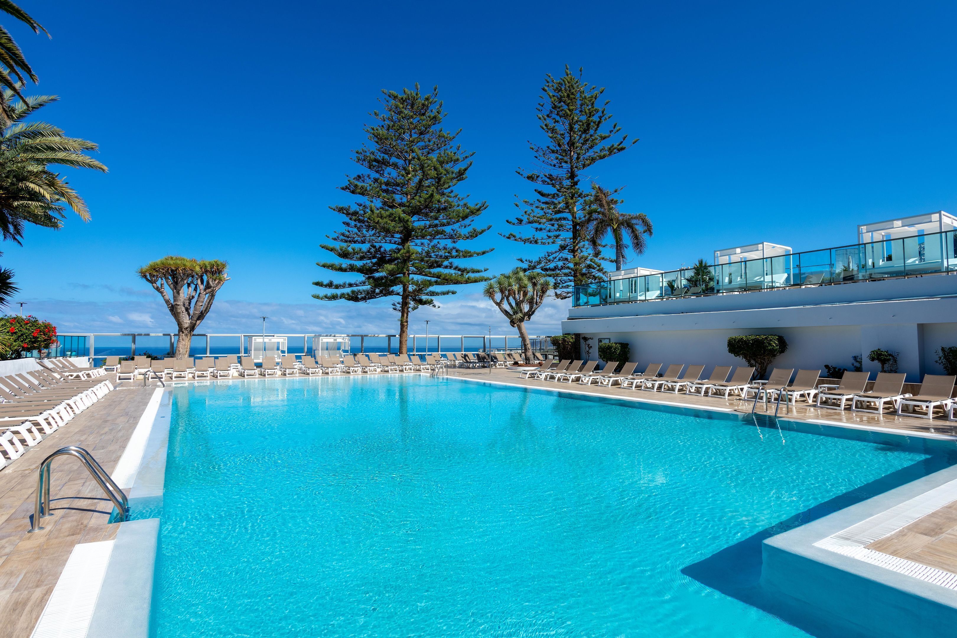 Indoor pool, outdoor pool, pool umbrellas, sun loungers
