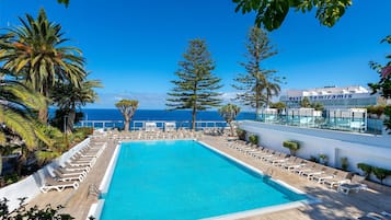 Indoor pool, outdoor pool, pool umbrellas, pool loungers