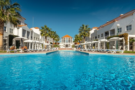 Indoor pool, outdoor pool, pool umbrellas, sun loungers