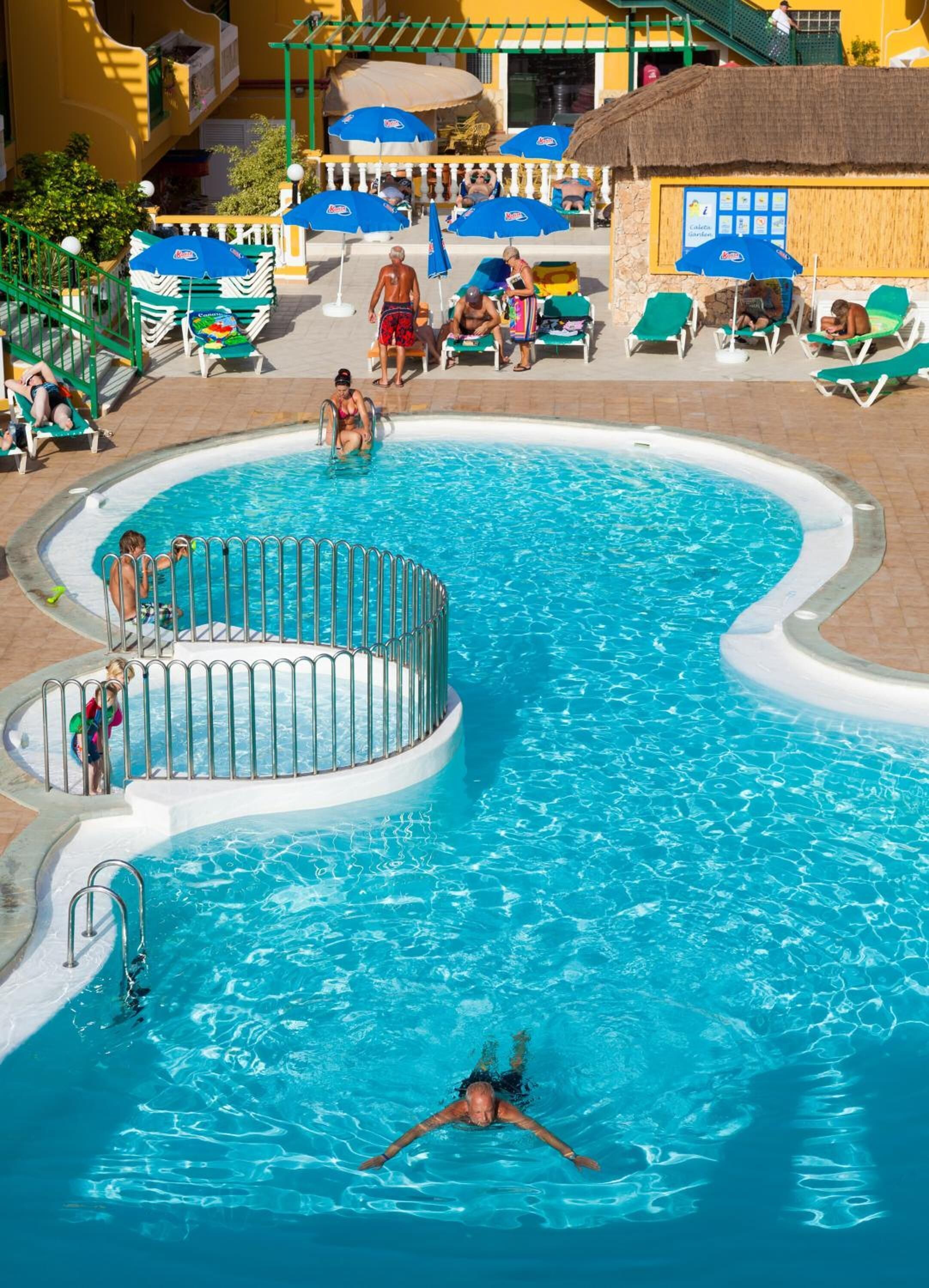 outdoor pool, pool umbrellas, pool loungers