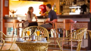 A bar area with wicker chairs and a table with breakfast items. - Caleta Garden (Antigua)