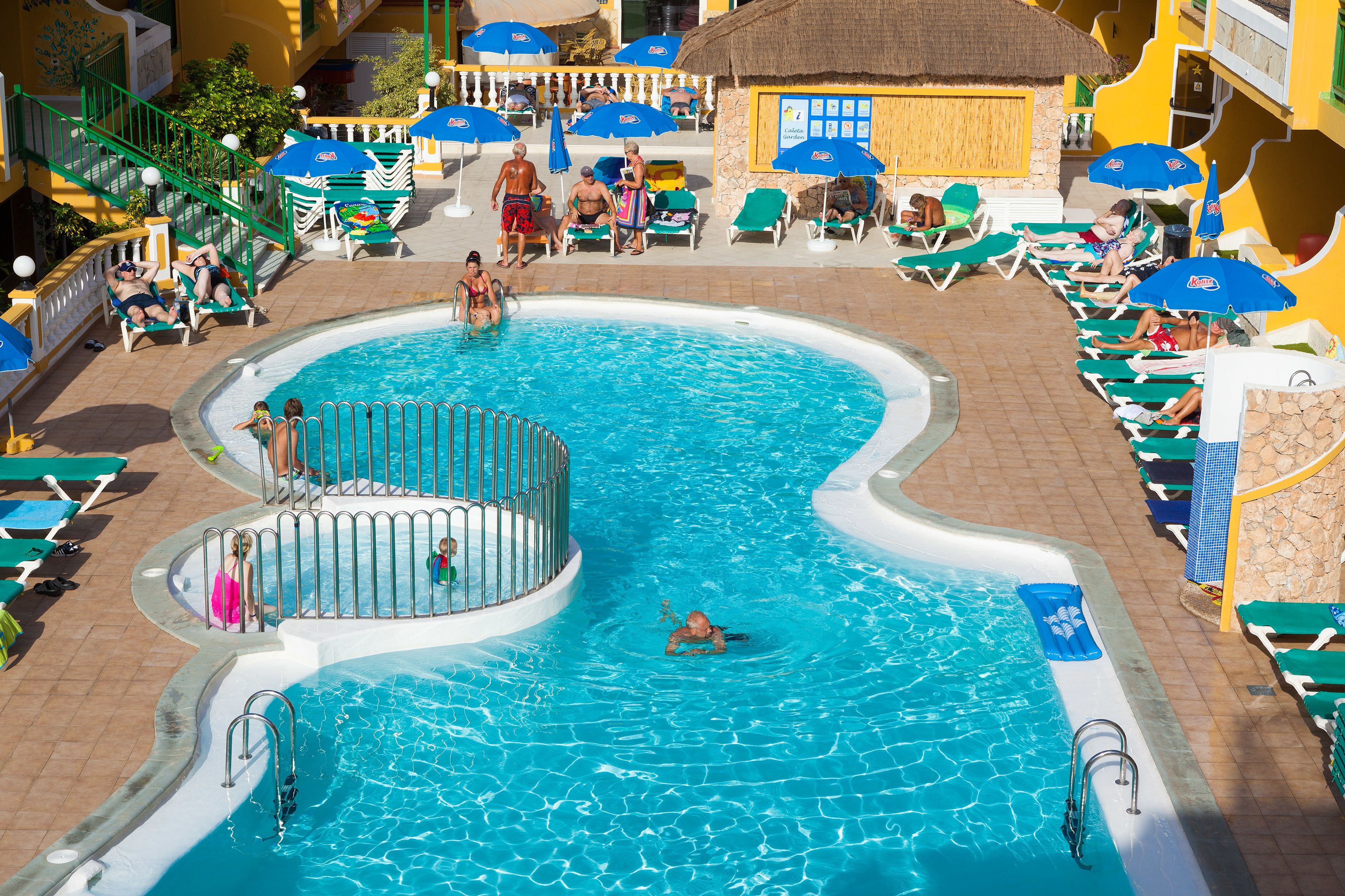 outdoor pool, pool umbrellas, pool loungers