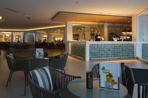 Relax in our spacious lobby with comfortable seating and a bar area.