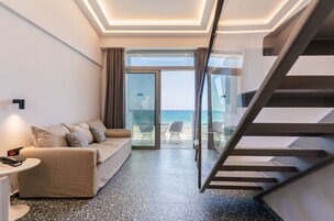 Junior Suite, Sea View | Minibar, in-room safe, desk, laptop workspace