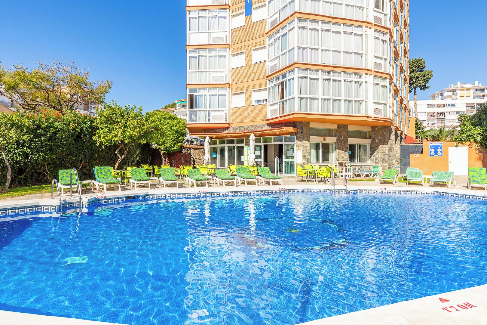 Outdoor pool, open 10:00 AM to 8:00 PM, pool loungers