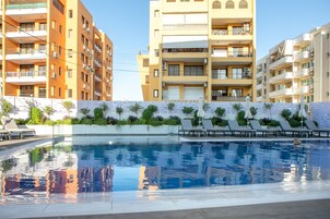 Outdoor pool, open 7:00 AM to 7:00 PM, pool umbrellas, sun loungers