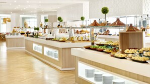 A buffet area with various food items and decorative elements. - Iberostar Waves Founty Beach -All Inclusive (Agadir)