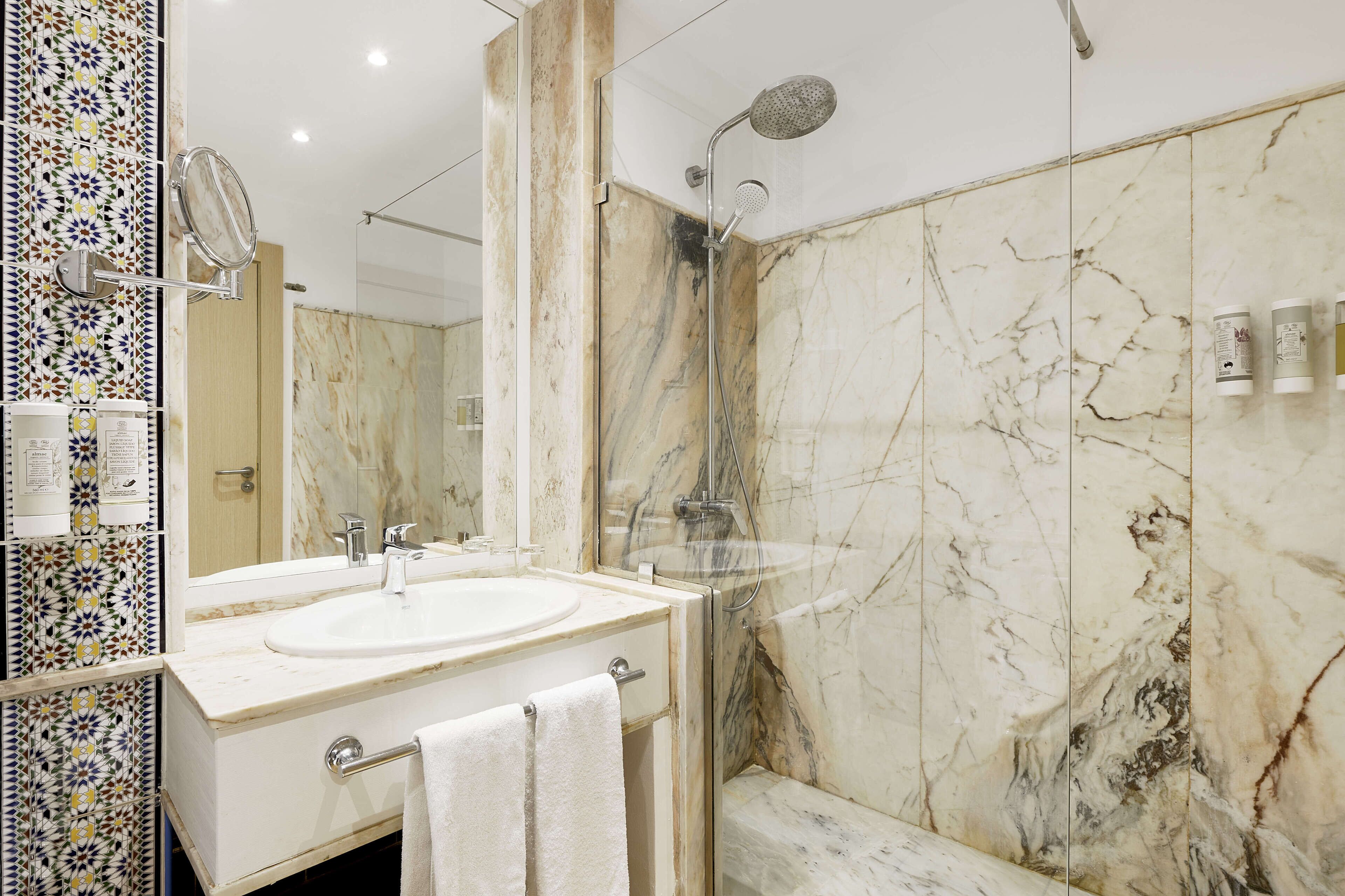 bathtub, eco-friendly toiletries, hair dryer, towels